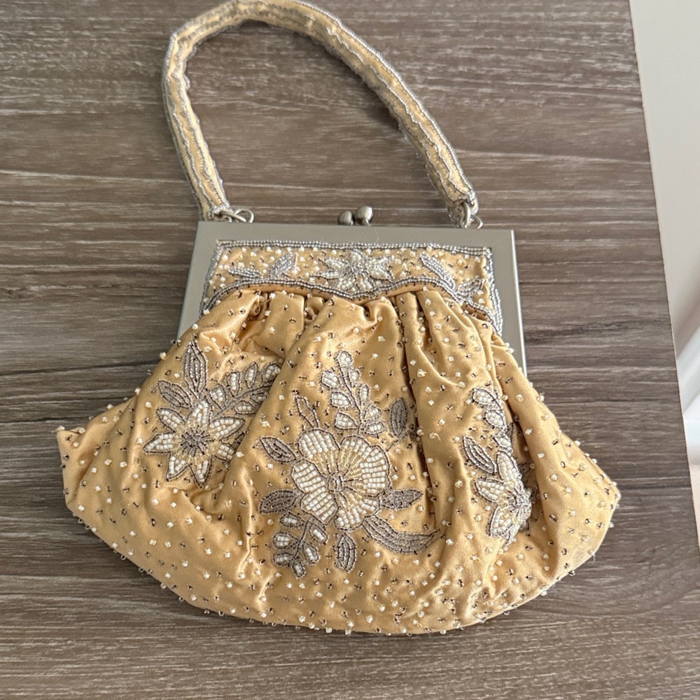 Elegant Gold Beaded Wristlet by [Brand]